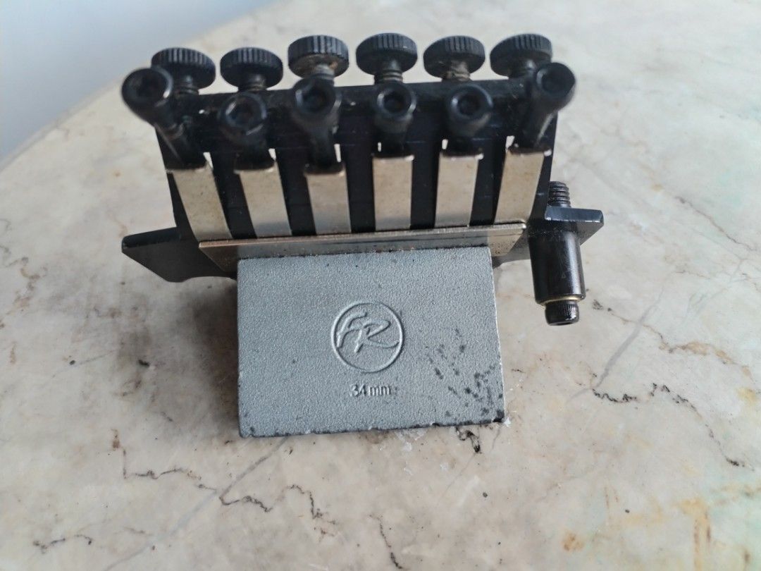 Floyd Rose Licensed Tremolo Bridge - Black (Category: Musical Instruments) located in Manila. Submitted by drako1 (Listing ID 1463733951, Image 2). Description: - Black tremolo bridge for electric guitar - Licensed under Floyd Rose patents - All parts seem to be included - Ready for installation.