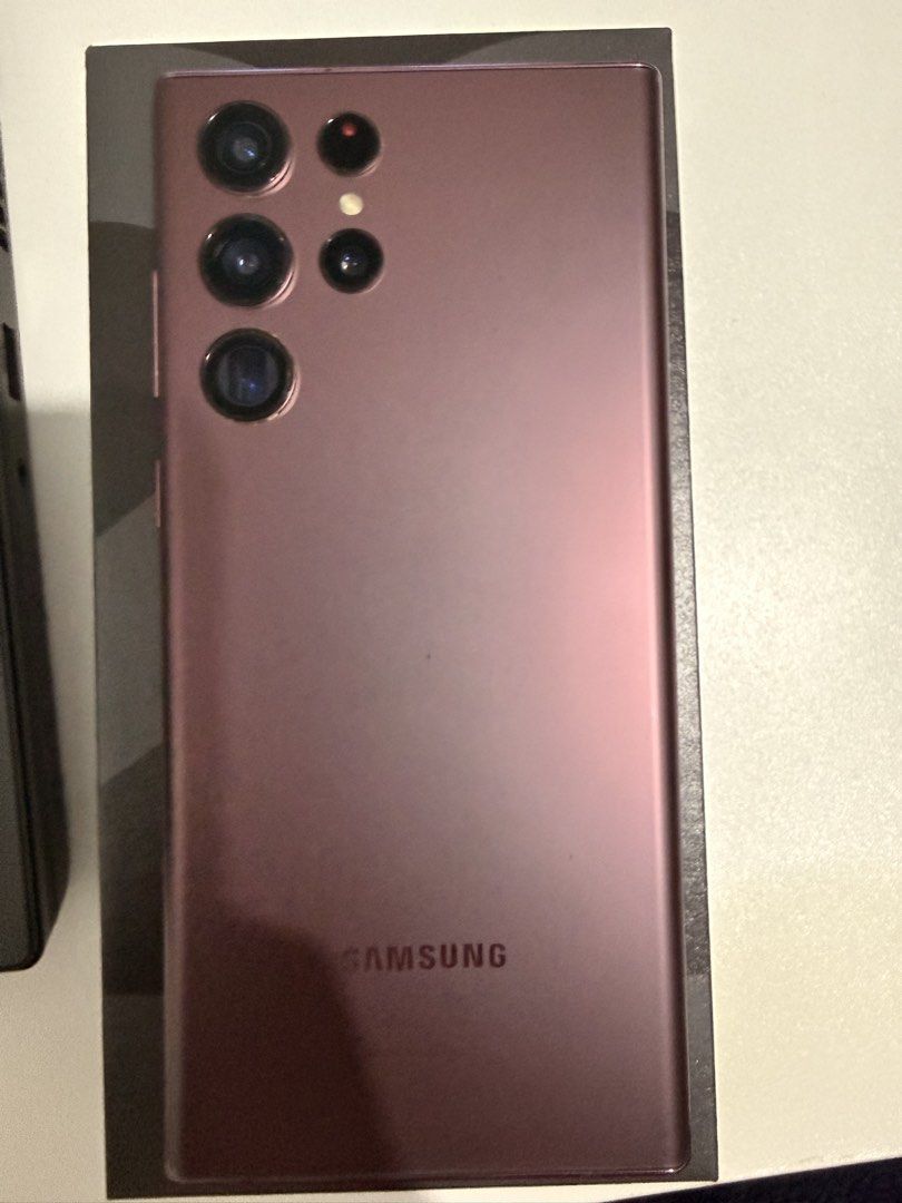 For sale S22 Ultra (Category: Samsung) located in Makati City. Submitted by PacBridgG (Listing ID 1463700802, Image 3). Description: - Samsung Galaxy S22 Ultra - Storage: 128GB - Color: Burgundy/Pinkish hue - Condition: Great, well-maintained - Includes original box - Available for meetups in Bonifacio Global City or Robinsons Manila.