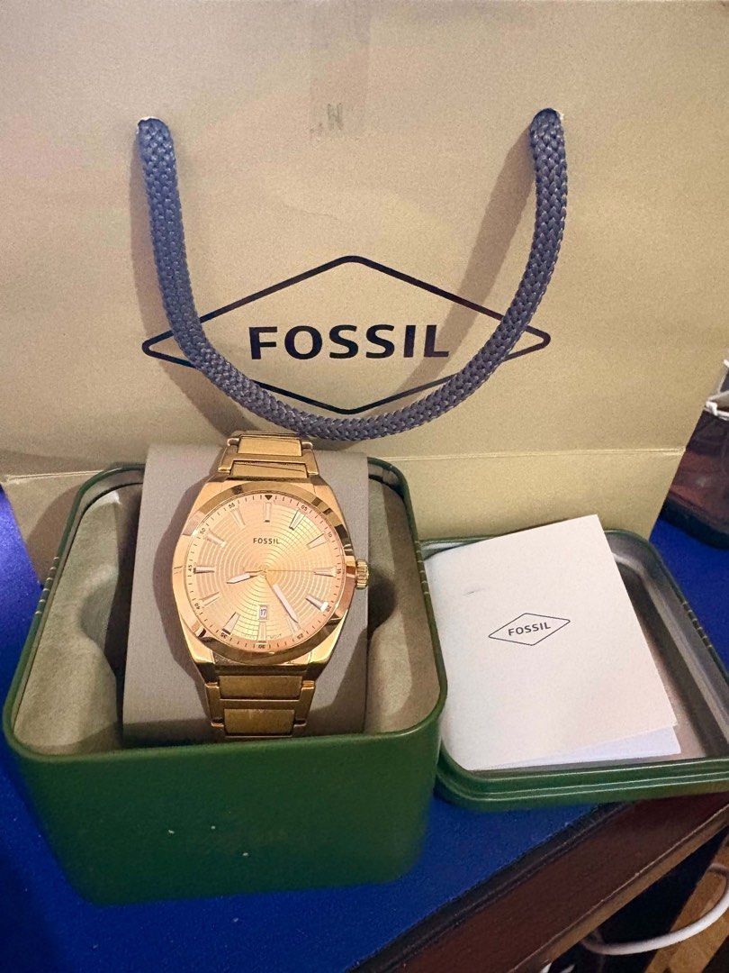 Fossil Rose Gold Watch with Date Window (Category: Men's Watches) located in Pasig City. Submitted by bjlaxamana (Listing ID 1463621416, Image 3). Description: - Elegant rose gold Fossil watch - Convenient date window at 3 o'clock - Beautiful textured dial pattern - Comes with original Fossil tin and box - Includes instruction manual - Versatile for everyday wear or special occasions.