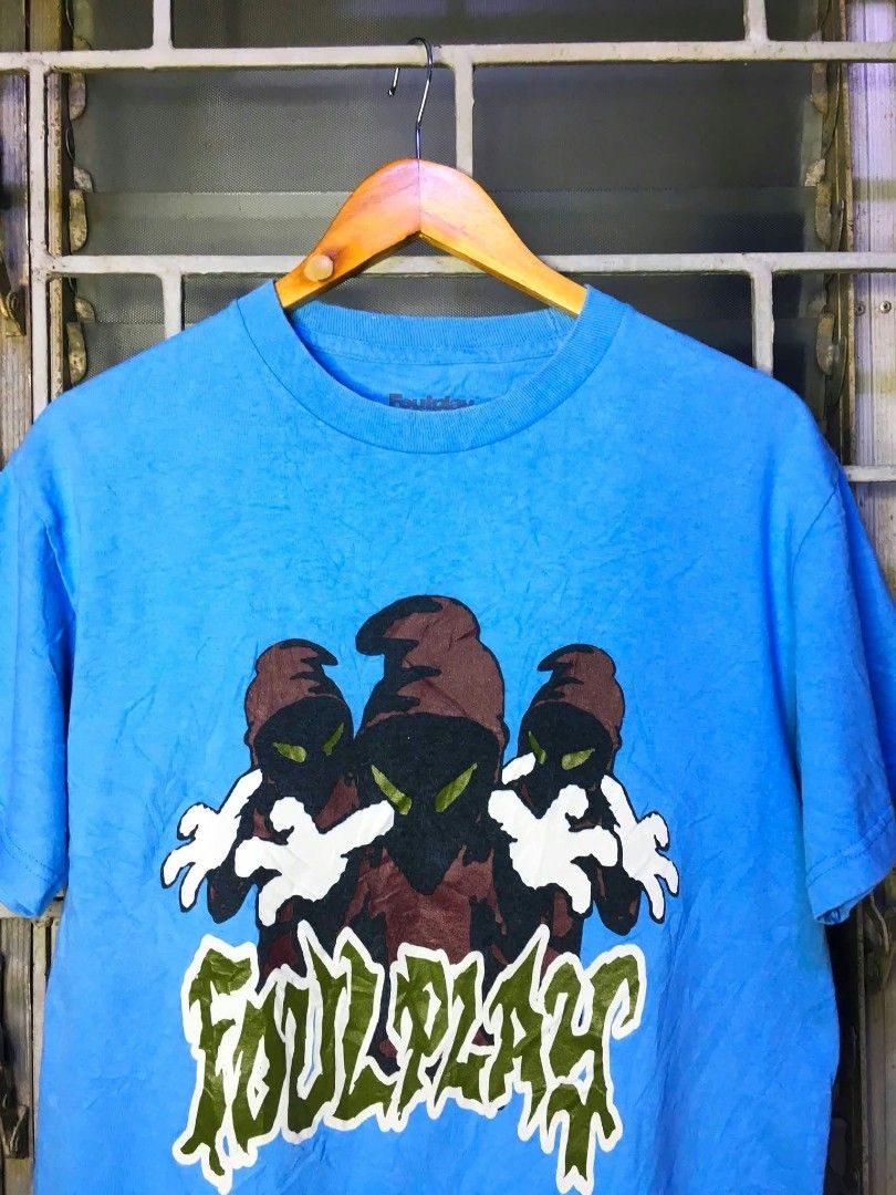 Foulplay Blue Graphic T-Shirt (Category: Tshirts & Polo Shirts ) located in Quezon City. Submitted by panicbuyer461 (Listing ID 1463684547, Image 1). Description: FOULPLAY Official Merch Medium on printed tag 19.5 width 27 length No flaws Beefy neck Very minimal sign of usage 1k.