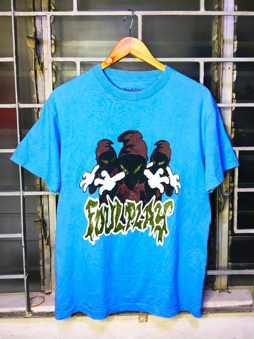 Foulplay Blue Graphic T-Shirt (Category: Tshirts & Polo Shirts ) located in Quezon City. Submitted by panicbuyer461 (Listing ID 1463684547, Image 3). Description: FOULPLAY Official Merch Medium on printed tag 19.5 width 27 length No flaws Beefy neck Very minimal sign of usage 1k.