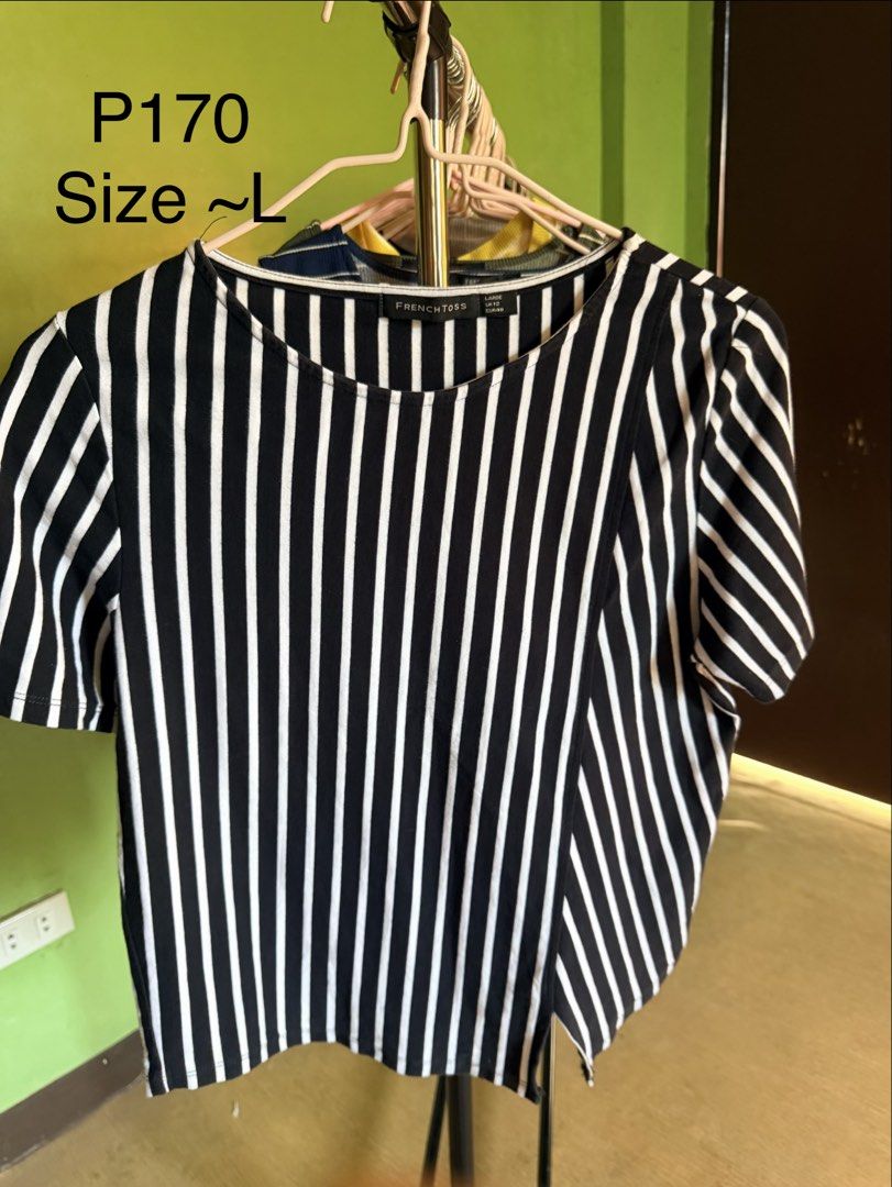 French Toss Black and White Striped Top (Category: Blouses) located in Muntinlupa City. Submitted by cocofinds023 (Listing ID 1463712724, Image 1). Description: - French Toss black and white striped top - Short sleeves with a slight puff - Asymmetrical hemline with a side slit - Comfortable and stylish for everyday wear.