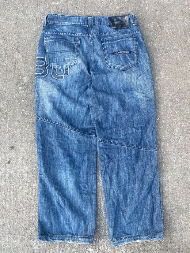 FUBU The Collection Patchwork Denim Jeans (Category: Jeans) located in Bacolod City. Submitted by carlo1019 (Listing ID 1463615004, Image 2). Description: - FUBU The Collection Jeans - Unique patchwork design with plaid and denim panels - FUBU logo featured on front and back - Classic blue wash - Perfect for a streetwear aesthetic - Size clearly indicated on the tag.