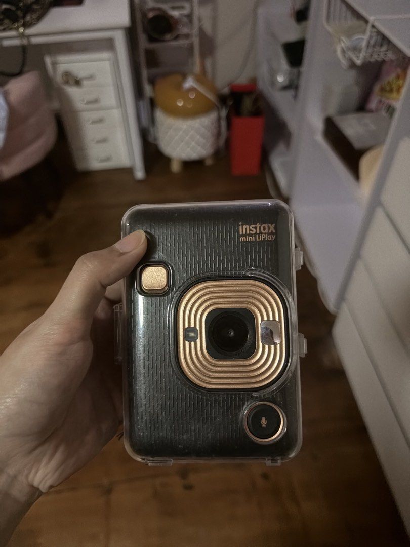Fujifilm Instax Mini LiPlay Instant Camera (Category: Cameras) located in Calamba. Submitted by cesslajara (Listing ID 1463656522, Image 1). Description: - Fujifilm Instax Mini LiPlay: Compact instant camera - Instant Photo Taking & Printing: Capture and print memories on the spot - Built-in Preview Screen: See your shot before you print - Includes Clear Protective Case: Keep your camera safe and stylish - Ideal for Parties & Events: Create fun, 