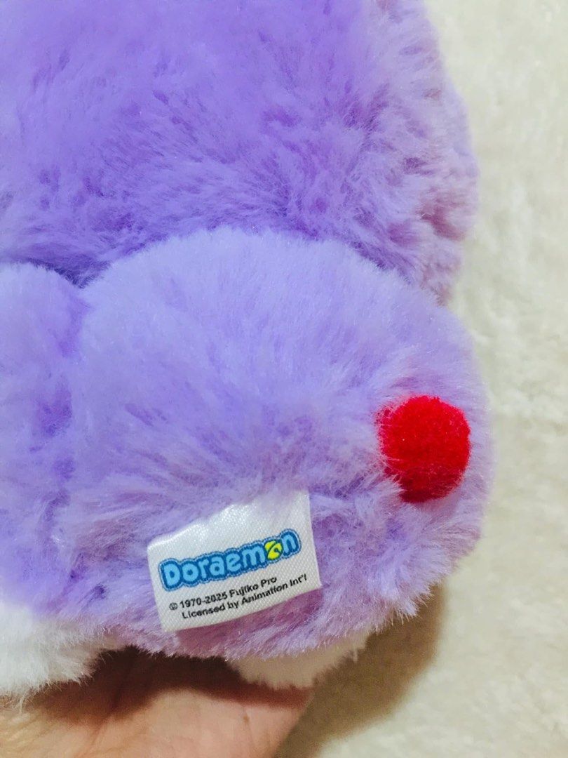 FUJIKO PRO Doraemon lucky cat (Category: Plushies & Soft Toys) located in Baguio. Submitted by izza_thrifty (Listing ID 1463671346, Image 3). Description: - Adorable Doraemon plush toy - Features a cute purple hoodie - Has a little bell around its neck - Super soft and cuddly material - Ideal gift for Doraemon enthusiasts - Approximately [Insert size here if known].