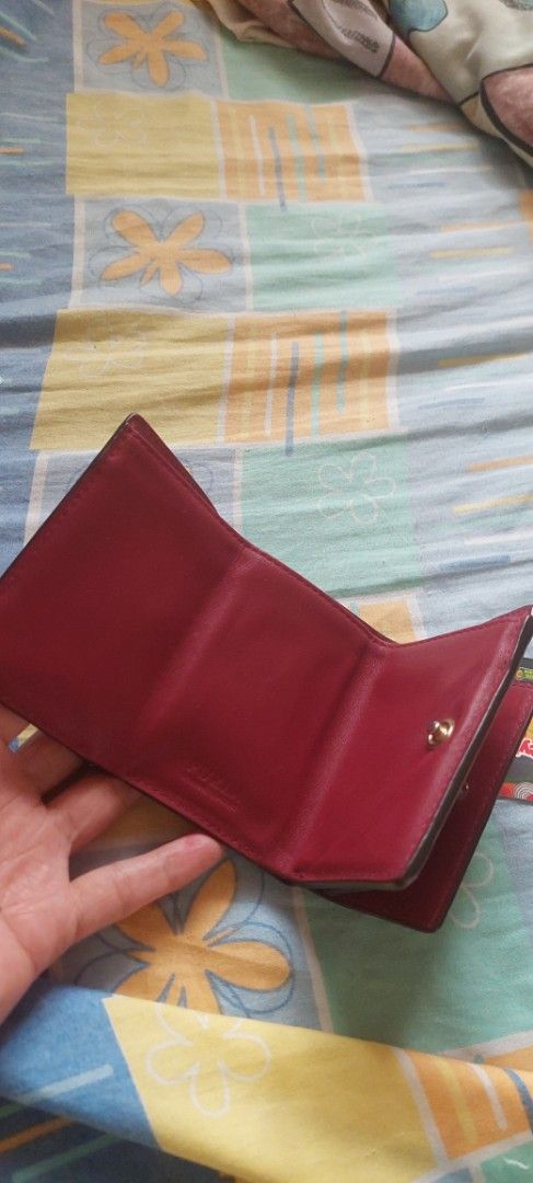 Furla Burgundy Leather Tri-fold Wallet (Category: Luxury Bags & Wallets) located in Baguio. Submitted by lotus_blossom (Listing ID 1463556252, Image 2). Description: - Authentic Furla tri-fold wallet - Rich burgundy leather - Secure snap closure - Multiple interior card slots - Convenient coin pocket - Compact and stylish design - Minimal cards lang po, siguro 2 or 3 lang ang Kaya - FLAW, shown on last picture, no other flaws - buyer shoulders sh