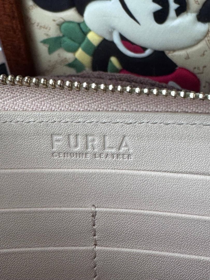 Furla Genuine Leather Pink Zip Around Wallet (Category: Wallets & Card holders) located in Labrador. Submitted by bagwalletaccessoriesfromjapan (Listing ID 1463634152, Image 2). Description: ✨ FURLA ZIP AROUND LONG WALLET — BLUSH PINK LEATHER ✨ Soft and elegant Furla design in beautiful blush pink! 🌸💖 Genuine pebbled leather with signature gold-tone emblem — feminine, durable, and timeless 💅 ✅ 100% Authentic Furla ✅ Great condition — well main