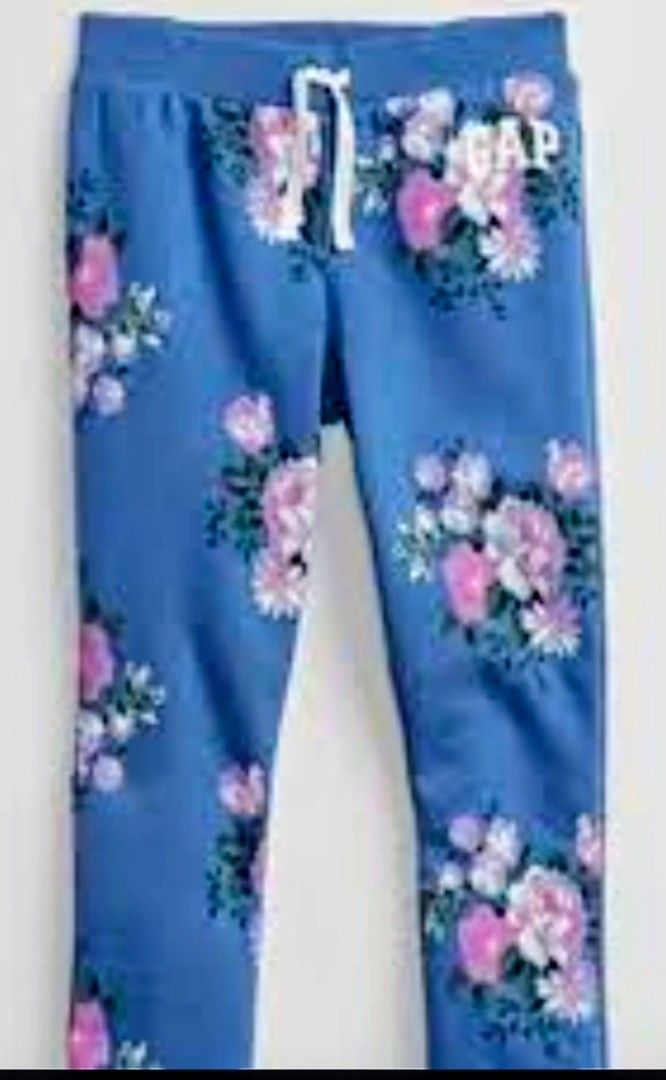 GAP Blue Floral Sweatpants Joggers (Category: Joggers) located in Quezon City. Submitted by shinereign (Listing ID 1463633834, Image 2). Description: - Cute blue sweatpants from GAP - All-over floral print with pink and white flowers - Elastic waistband with drawstring - Ribbed cuffs - Ideal for lounging or casual wear - Comfortable and stylish available size XL (12)''L(10) .