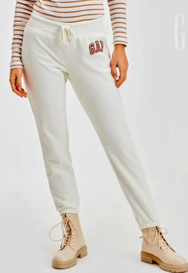 GAP Cream Embroidered Logo Sweatpants (Category: Activewear) located in Quezon City. Submitted by shinereign (Listing ID 1463632380, Image 2). Description: - Cream colored sweatpants from GAP - Features classic embroidered GAP logo on left leg - Elastic waistband with drawstring - Cuffed ankles - Comfortable and casual, great for lounging or everyday wear SUPER SALE NO MORE LAST PRICE sizes available Medium and Large.