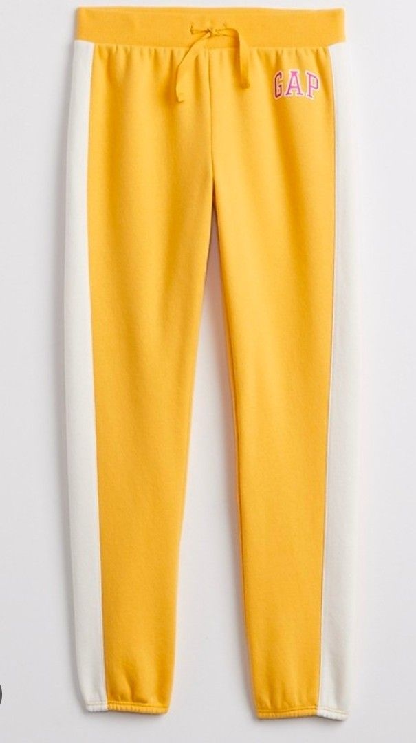 GAP Yellow Sweatpants with White Stripes (Category: Activewear) located in Quezon City. Submitted by shinereign (Listing ID 1463634175, Image 2). Description: - Yellow GAP sweatpants - White stripes down the sides - Drawstring waist for adjustable comfort - Pink embroidered GAP logo on the left leg - Super comfy and stylish for everyday wear size XXL (14-16).