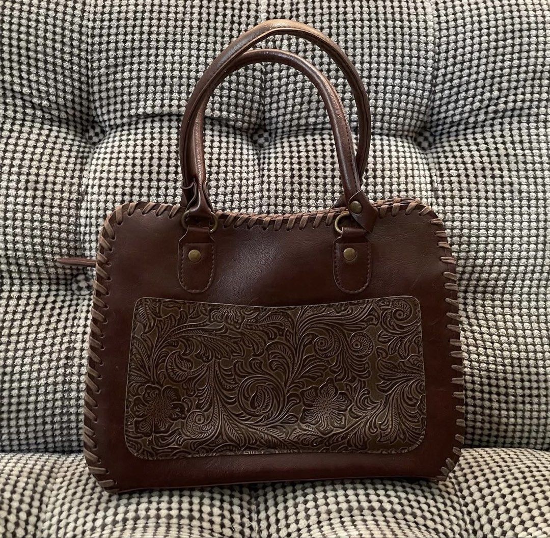 Genuine leather handtooled bag (Category: Shoulder Bags) located in Bulacan. Submitted by thriftbagcollections (Listing ID 1463679605, Image 1). Description: Genuine leather handtooled bag,good condition with signs of usage Approx:H-6.5”W-9” D-2.7” handle 5.5” .