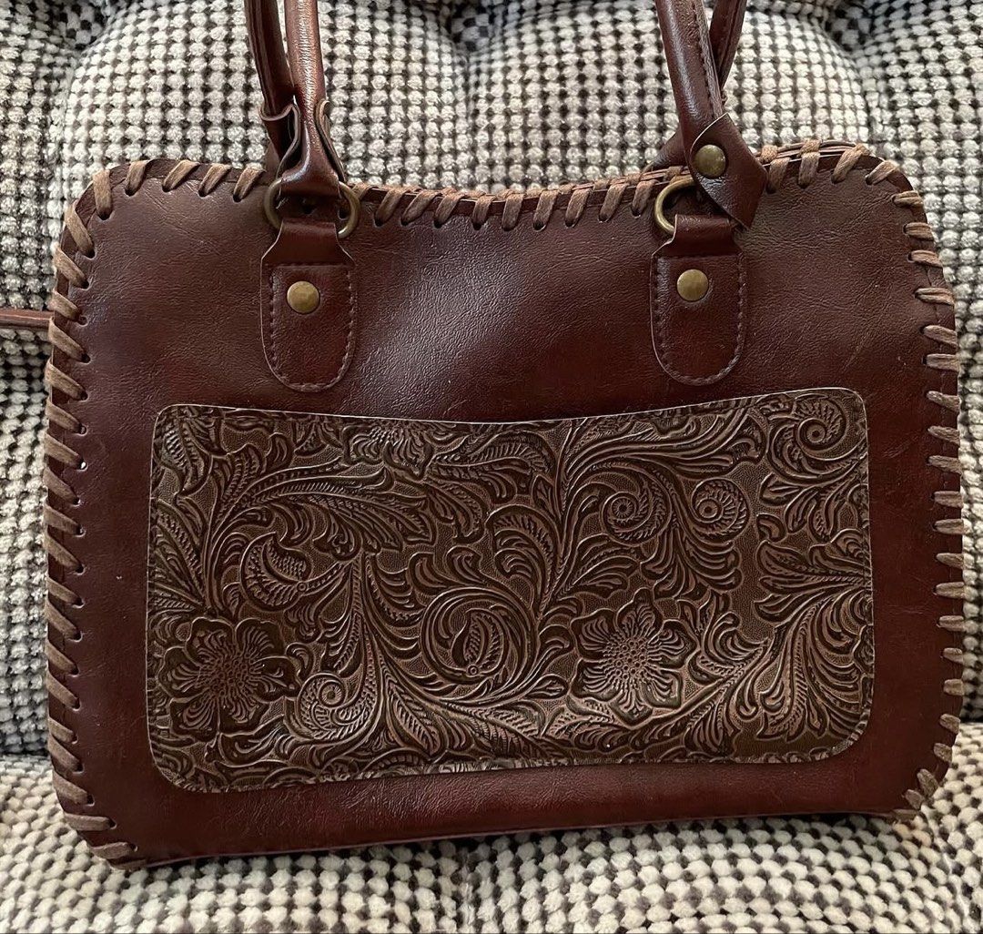 Genuine leather handtooled bag (Category: Shoulder Bags) located in Bulacan. Submitted by thriftbagcollections (Listing ID 1463679605, Image 2). Description: Genuine leather handtooled bag,good condition with signs of usage Approx:H-6.5”W-9” D-2.7” handle 5.5” .