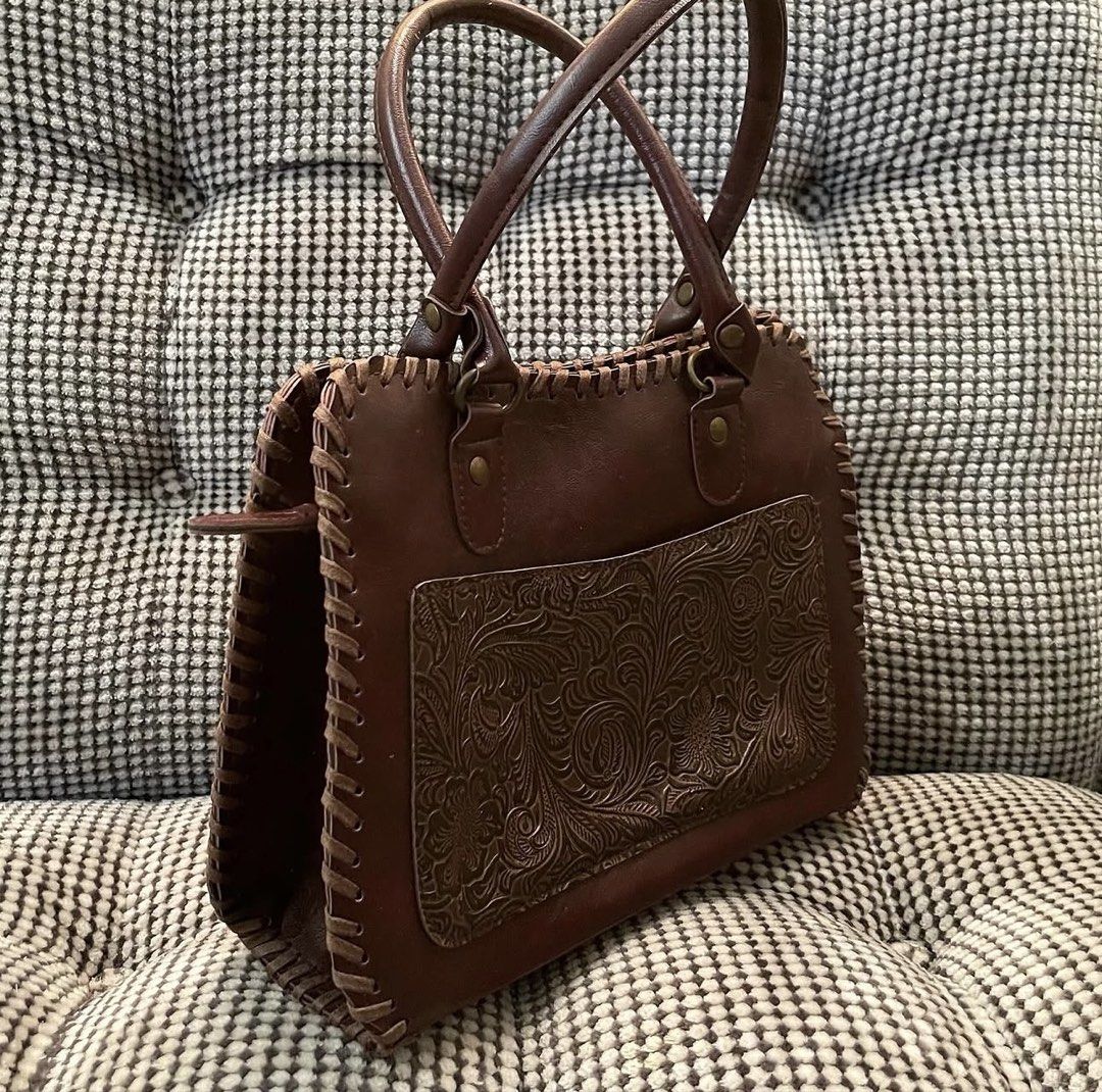 Genuine leather handtooled bag (Category: Shoulder Bags) located in Bulacan. Submitted by thriftbagcollections (Listing ID 1463679605, Image 3). Description: Genuine leather handtooled bag,good condition with signs of usage Approx:H-6.5”W-9” D-2.7” handle 5.5” .