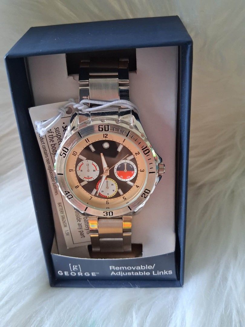 George Men's Stainless Steel Watch (Category: Men's Watches) located in Imus. Submitted by faststone.feb729 (Listing ID 1463697341, Image 1). Description: - Brand new George watch in original box - Silver-tone stainless steel band with adjustable links - Dark watch face with silver-tone hour markers - Three functional sub-dials - Uses SR626SW 1.5V battery - Ideal for everyday wear or as a thoughtful gift.