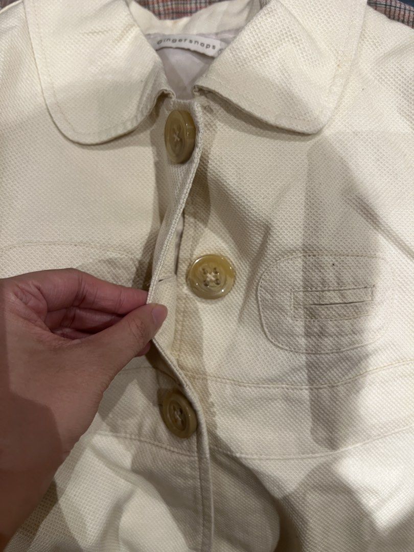 Ginger snaps cream collared jacket with buttons (Category: Coats, Jackets and Outerwear) located in Quezon City. Submitted by iminquezoncity (Listing ID 1463662403, Image 2). Description: - Cream-colored jacket from Ginger snaps - Features a classic Peter Pan collar - Button-down front closure - Two functional front pockets - Estimated size 12 - Ideal for layering over outfits.