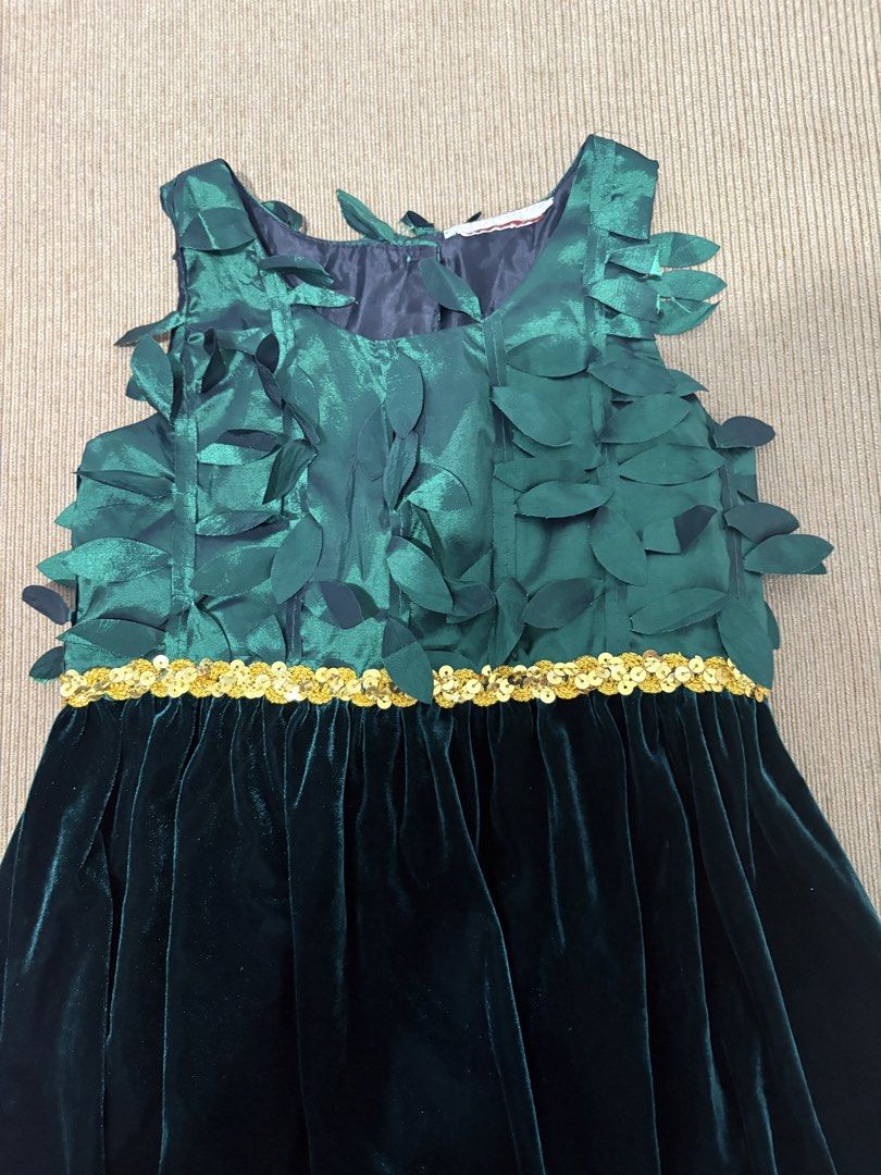 Girls Emerald Green for Christmas (Category: Babies & Kids Fashion) located in San Fernando. Submitted by lovedbyjoy (Listing ID 1463580940, Image 2). Description: - Beautiful emerald green dress for girls - Unique leaf design on the bodice - Sparkly gold sequin trim separating bodice and velvet skirt - Sleeveless design - Ideal for parties and special occasions - Zipper closure at the back.