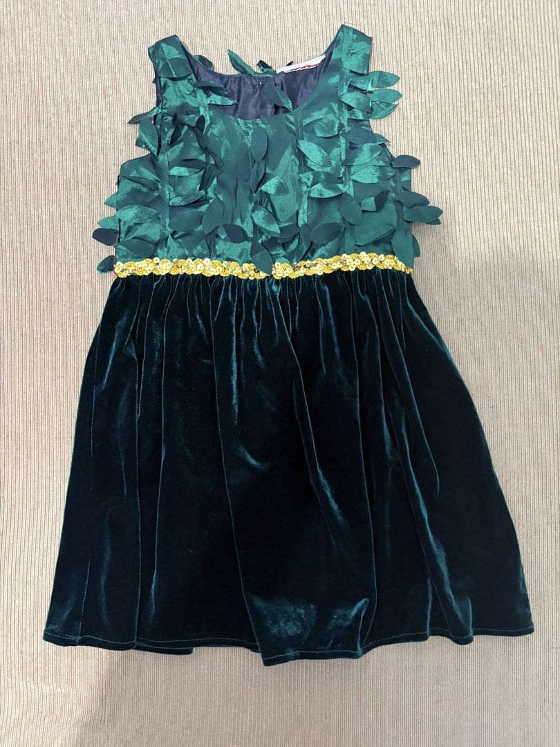 Girls Emerald Green for Christmas (Category: Babies & Kids Fashion) located in San Fernando. Submitted by lovedbyjoy (Listing ID 1463580940, Image 1). Description: - Beautiful emerald green dress for girls - Unique leaf design on the bodice - Sparkly gold sequin trim separating bodice and velvet skirt - Sleeveless design - Ideal for parties and special occasions - Zipper closure at the back.