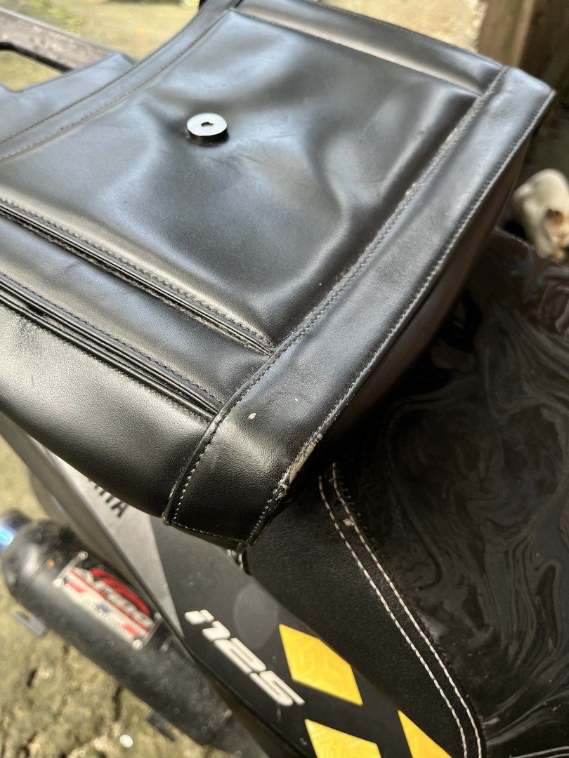 Givenchy Black Leather Handbag (Category: Luxury Bags & Wallets) located in Manila. Submitted by shanaaa.collects (Listing ID 1463574986, Image 3). Description: - Authentic Givenchy black leather handbag - Features iconic Givenchy logo clasp - Interior branding: Givenchy Paris - Closure: Magnetic snap - Condition: Minor scuffing on bottom corners - A classic, timeless piece.