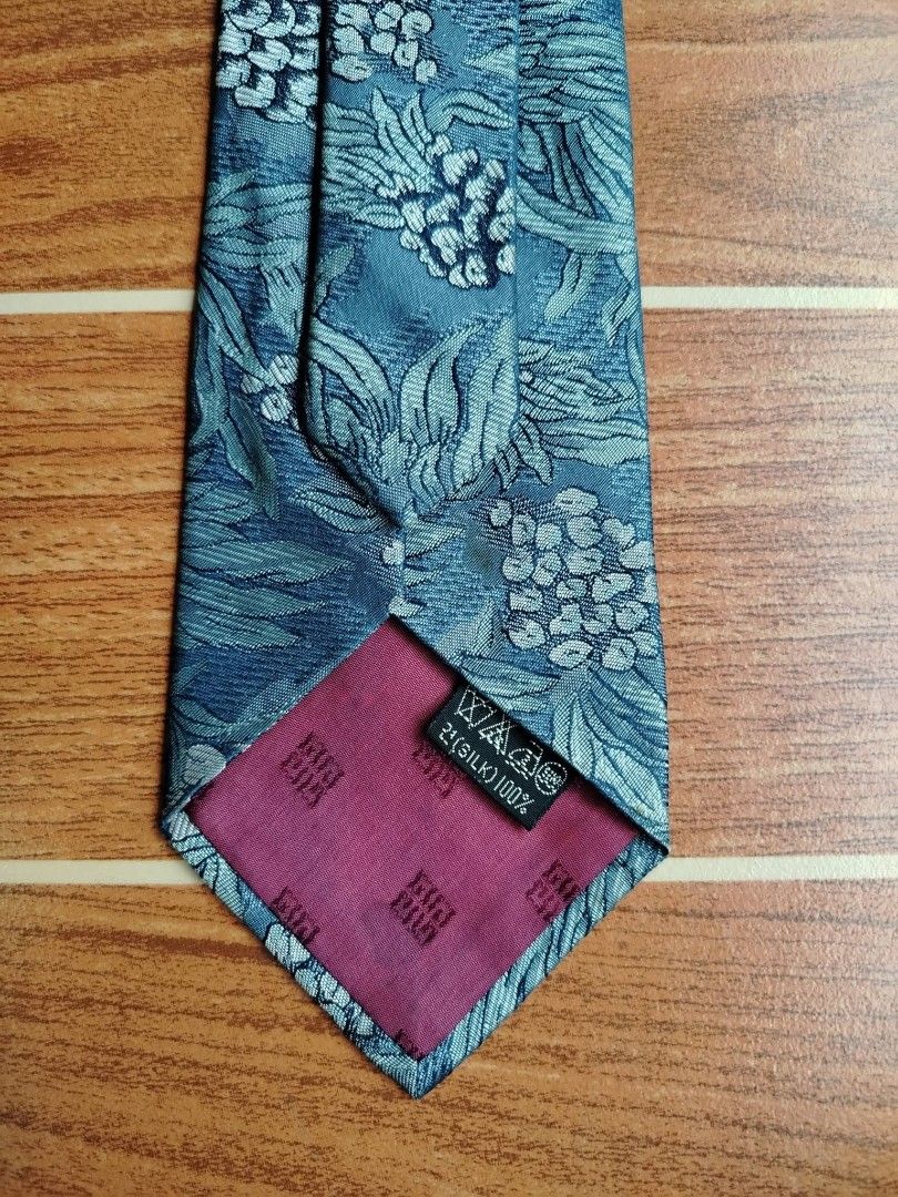 Givenchy Tie (Category: Ties) located in Butuan. Submitted by lovzthriftshop. (Listing ID 1463587308, Image 3). Description: ‼️ Givenchy Cravates Silk Tie‼️ ✅ Material : 100% silk ✅ Design : Tropical pineapple and botanical jacquard weave with embroidered Givenchy cursive signature on the front Pre owned condition with tags and no visible flaws 📩 📩 📩.
