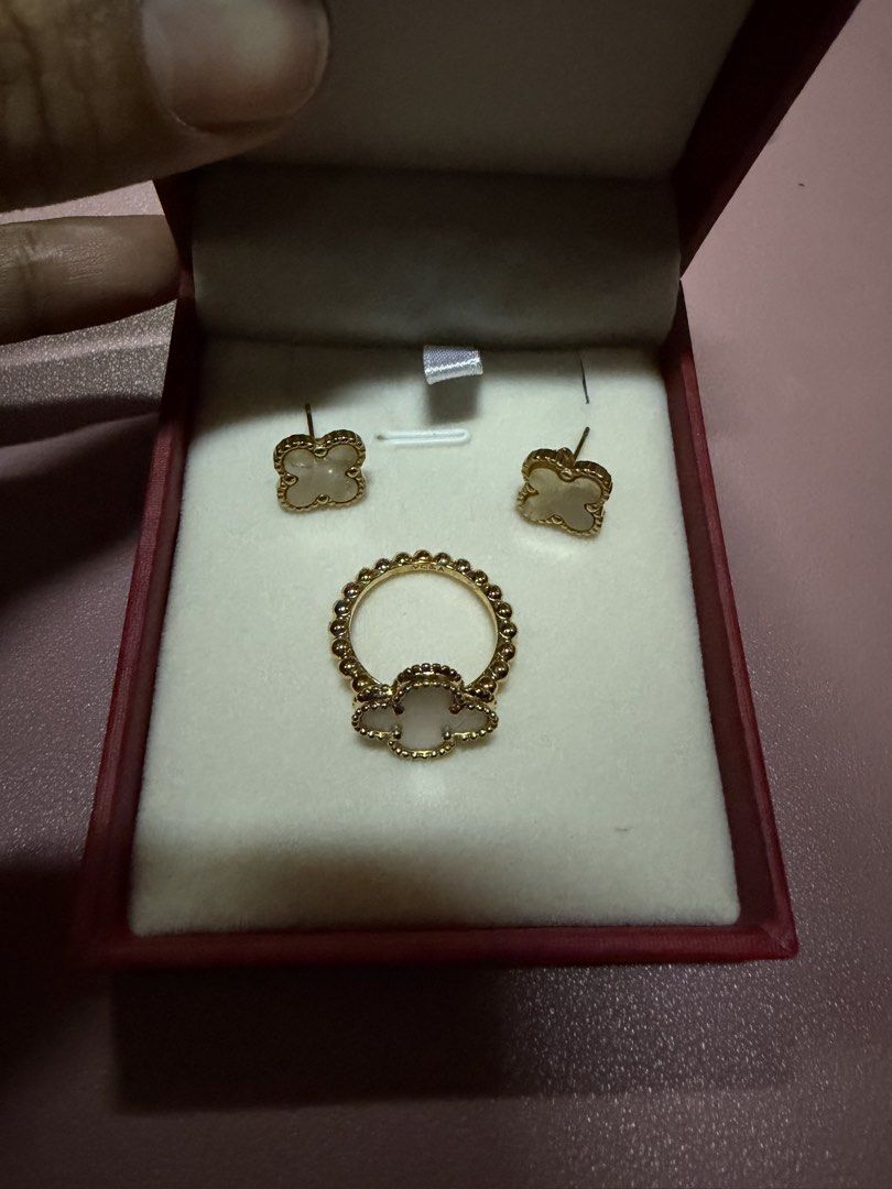 Gold Clover Ring and Earrings Set with White Stone (Category: Earrings) located in Pasig City. Submitted by aprilluxcloset0812 (Listing ID 1463737573, Image 2). Description: - Beautiful gold clover set - Includes matching ring and stud earrings - Clover design accented with small white stones - Ring band features a beaded texture - Ideal for gifting or personal treat Fashion Accessories ONLY, NO BOX (Box is for photo ops purpose only) Small ziplo