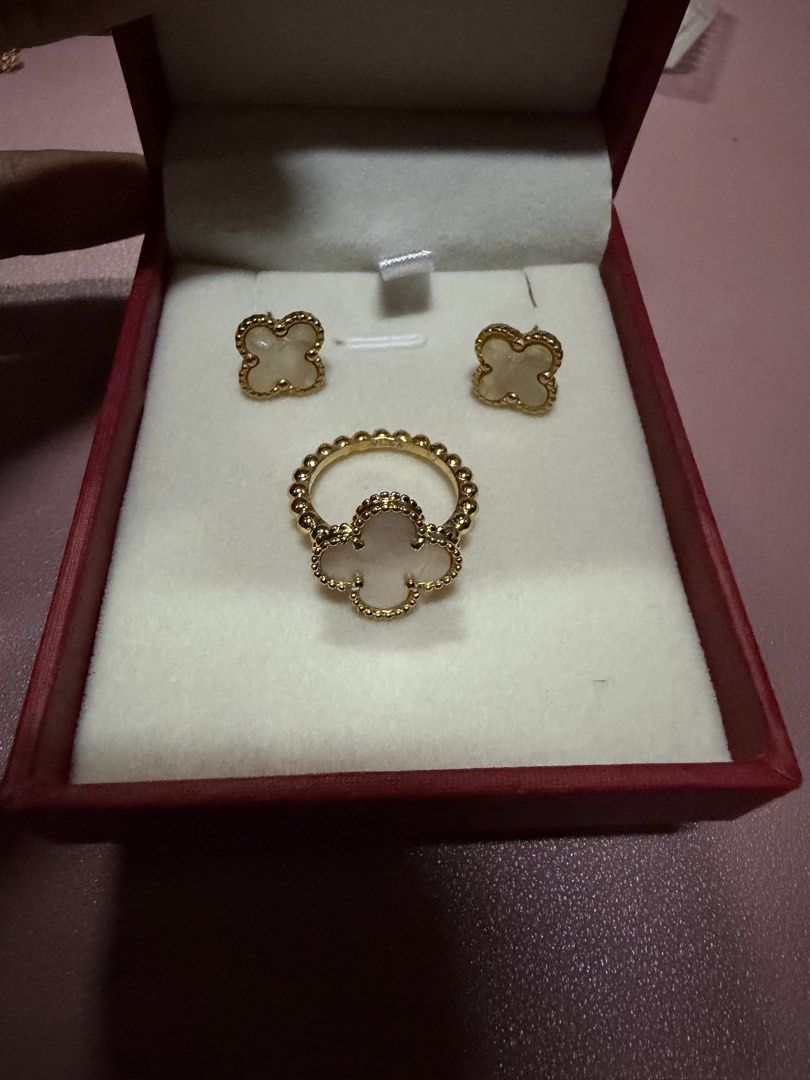 Gold Clover Ring and Earrings Set with White Stone (Category: Earrings) located in Pasig City. Submitted by aprilluxcloset0812 (Listing ID 1463737573, Image 1). Description: - Beautiful gold clover set - Includes matching ring and stud earrings - Clover design accented with small white stones - Ring band features a beaded texture - Ideal for gifting or personal treat Fashion Accessories ONLY, NO BOX (Box is for photo ops purpose only) Small ziplo