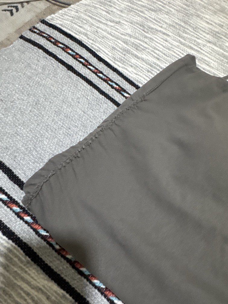 Gray singlet (Category: Activewear) located in Kuala Lumpur. Submitted by aphrodite_athena (Listing ID 1463639080, Image 2). Description: Slightly padded and slightly defective at the side..