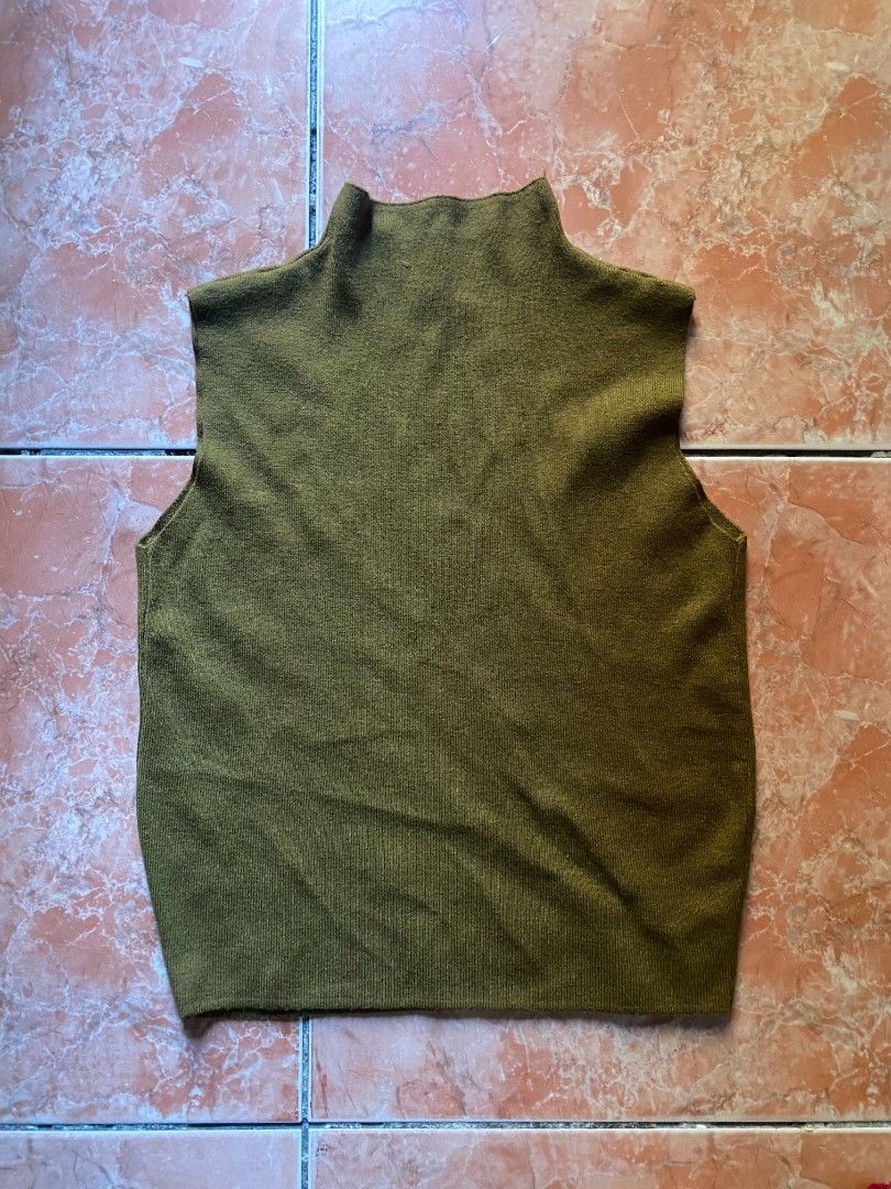Green and Red Knitted Tops (Category: Sleeveless) located in Quezon City. Submitted by ben.cube (Listing ID 1463637739, Image 1). Description: - Two sleeveless tops included. - One olive green top with a mock neck. - One deep burgundy top with a round neck. - Both tops are made of knitted material. - Ideal for layering or wearing on their own. - Versatile pieces to enhance your wardrobe..