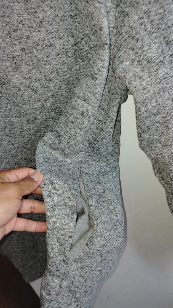 Grey Marled Hoodie with Pouch Pocket (Category: Coats, Jackets and Outerwear) located in Cavite. Submitted by ukaynglahat (Listing ID 1463626062, Image 3). Description: - Grey marled hoodie - Soft and comfortable fabric - Features a front pouch pocket - Ideal for casual wear - Versatile: pairs well with jeans or joggers.