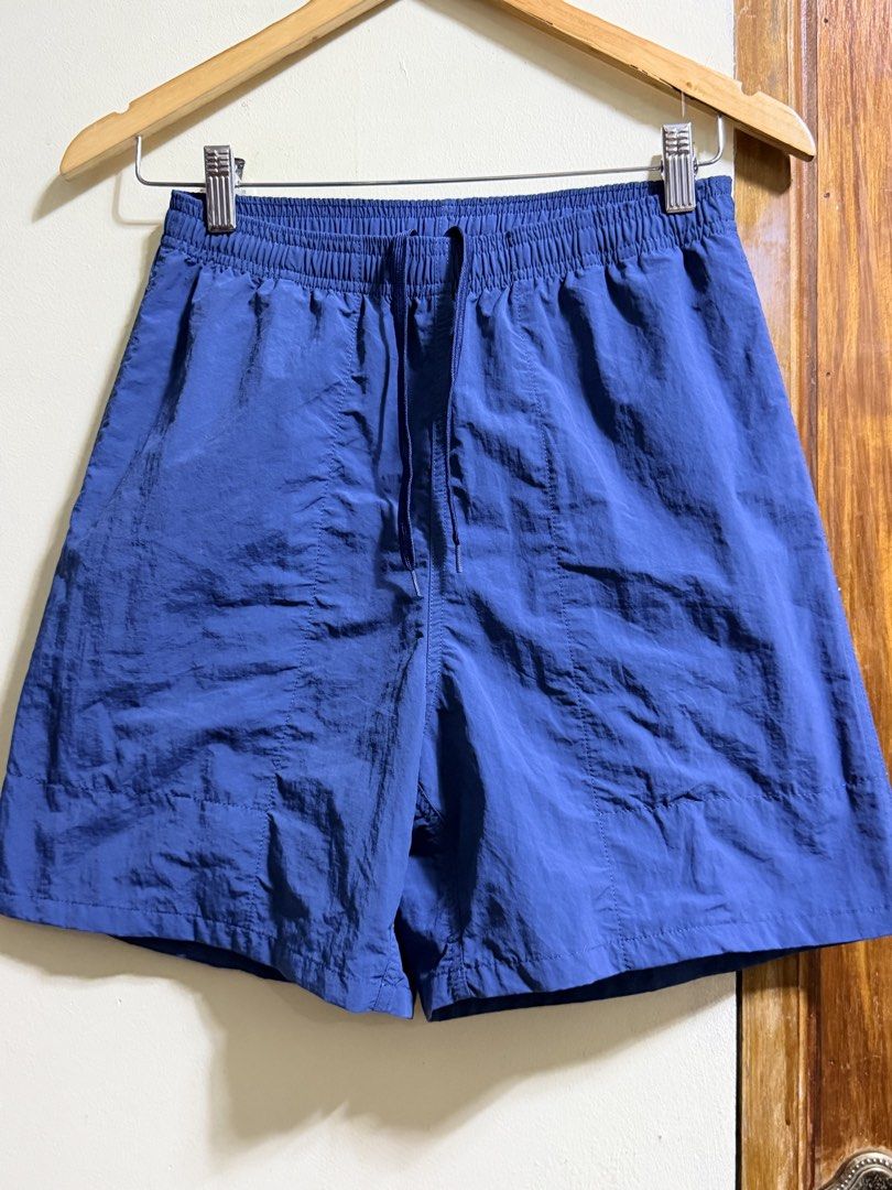 GU Blue Nylon Drawstring Elastic Waist Shorts Size S (Category: Shorts) located in Paete. Submitted by skydruemadison (Listing ID 1463697651, Image 1). Description: - GU blue nylon shorts - Size S - Elastic waistband with drawstring - Back pocket - Lightweight material - Ideal for casual wear or sports.