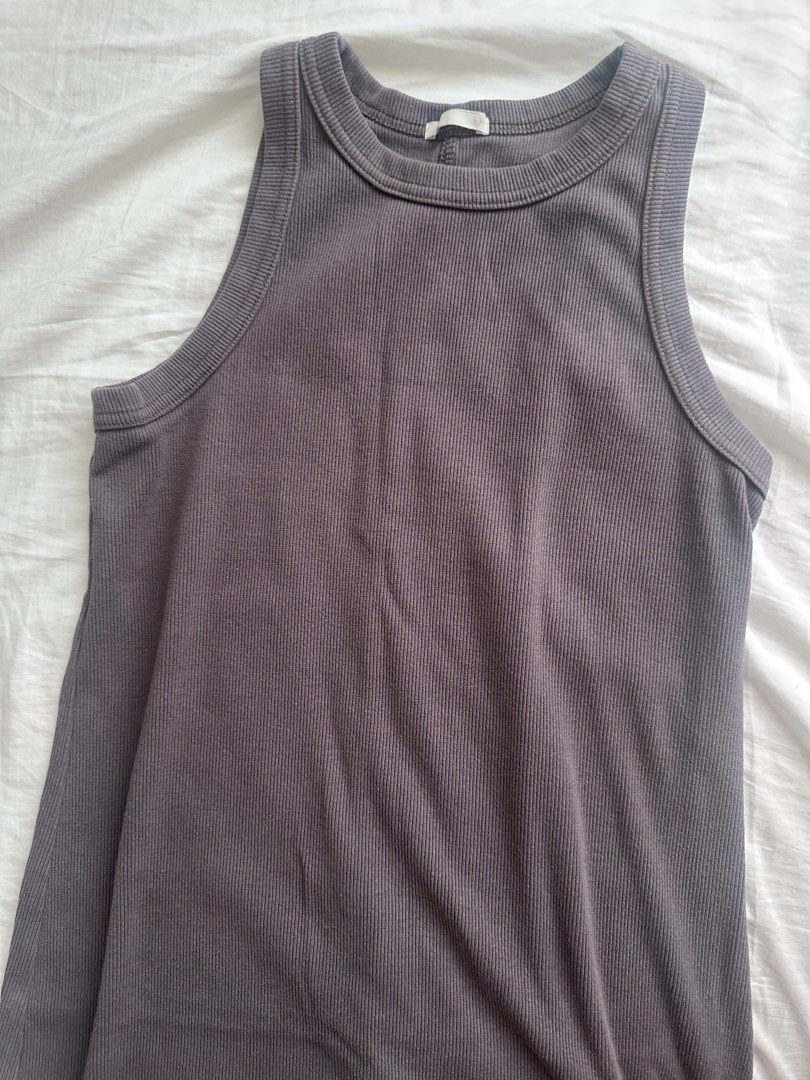 GU Ribbed bodycon Dress (Category: Dresses) located in Taguig. Submitted by beatrizangela (Listing ID 1463613538, Image 1). Description: - GU brand - ankle length with back slit - Grey ribbed tank dress - Sleeveless design - Comfortable and stretchy material - Perfect for layering or wearing solo - Simple and versatile.