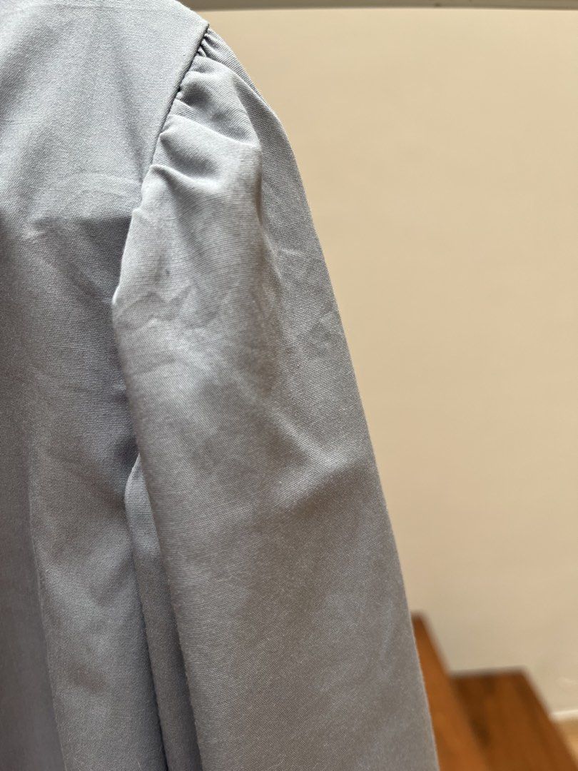 GU Tiered Midi Dress — Light Blue (Category: Dresses) located in Baguio. Submitted by nikkis.sale (Listing ID 1463587216, Image 3). Description: Brand: GU (Japan) Color: Light Blue Style: Feminine / Minimalist / Timeless Condition: Gently used, in good condition ✨ Details: * Elegant puff shoulders * Long sleeves with wide cuff detail * Flattering defined waist * Feminine tiered midi skirt * Back button closure * Relaxed, flowy silhouette * Easy t