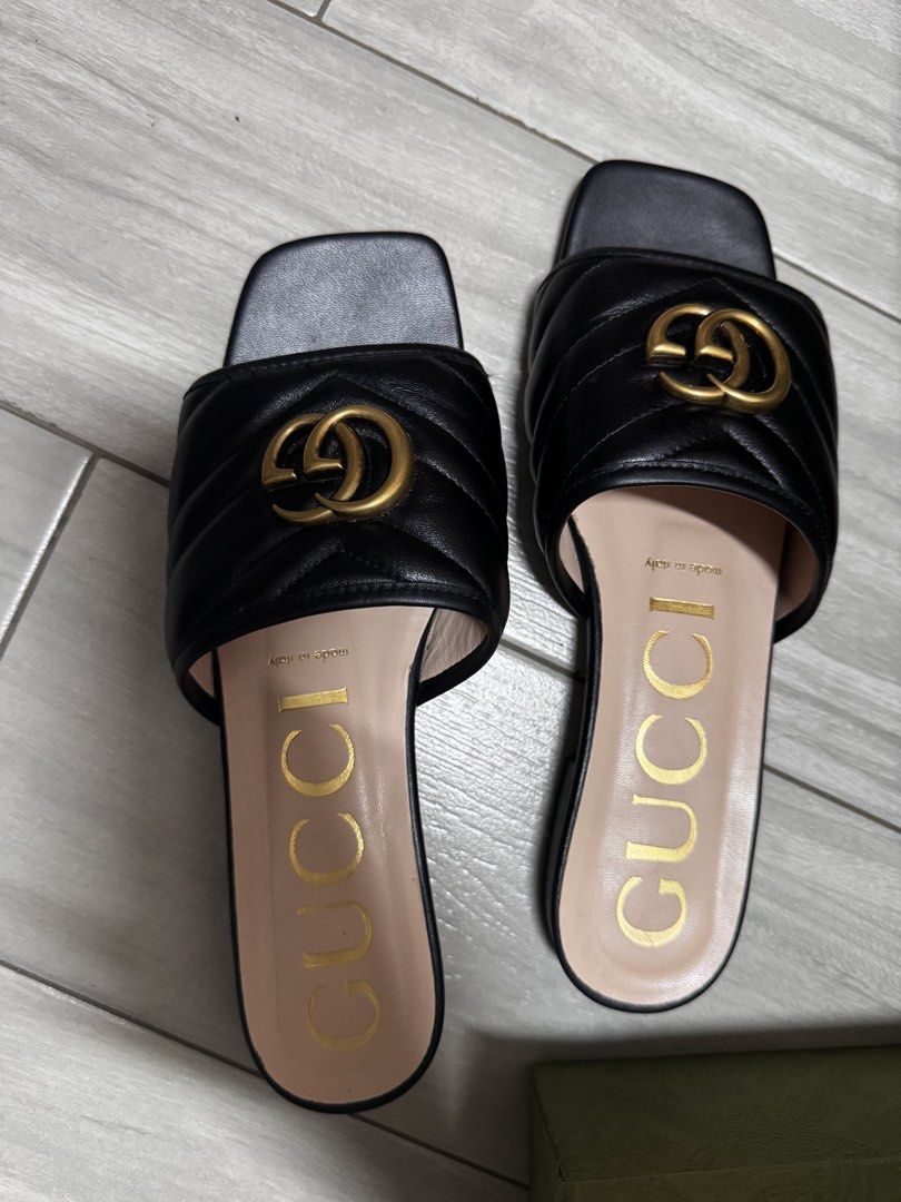 Gucci Black Quilted GG Marmont Slides (Category: Sneakers & Footwear) located in Paranaque City. Submitted by lersprelovedclothes (Listing ID 1463630138, Image 2). Description: - Authentic Gucci GG Marmont Slides - Color: Black - Features iconic GG Marmont quilting - Gold-tone hardware - Made in Italy - Includes original box and dust bag - Super comfortable and stylish for everyday wear - A classic Gucci piece.