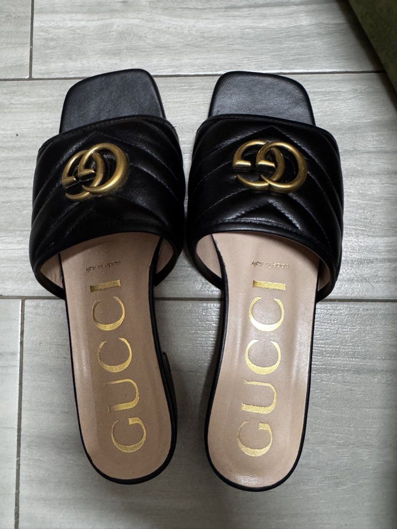 Gucci Black Quilted GG Marmont Slides (Category: Sneakers & Footwear) located in Paranaque City. Submitted by lersprelovedclothes (Listing ID 1463630138, Image 1). Description: - Authentic Gucci GG Marmont Slides - Color: Black - Features iconic GG Marmont quilting - Gold-tone hardware - Made in Italy - Includes original box and dust bag - Super comfortable and stylish for everyday wear - A classic Gucci piece.