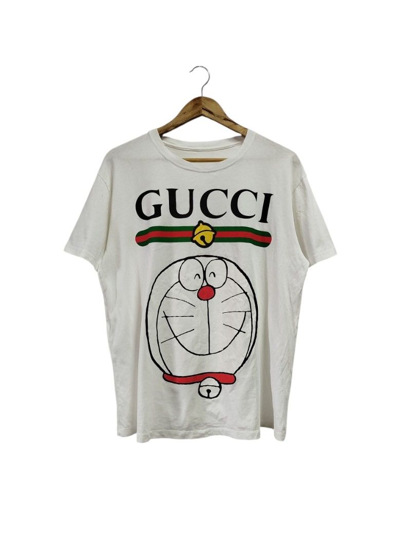 GUCCI DORAEMON WHITE SHIRT (Category: Tshirts & Polo Shirts ) located in Bayombong. Submitted by Gentlemans_ClosEt (Listing ID 1463644568, Image 1). Description: GUCCI X DORAEMON WHITE SHIRT (authentic) searchable code SIZE LARGE ON TAG DIMES: W21 x L26 EXCELLENT CONDITION MISSING MAINTAG/NECKTAG ONLY.