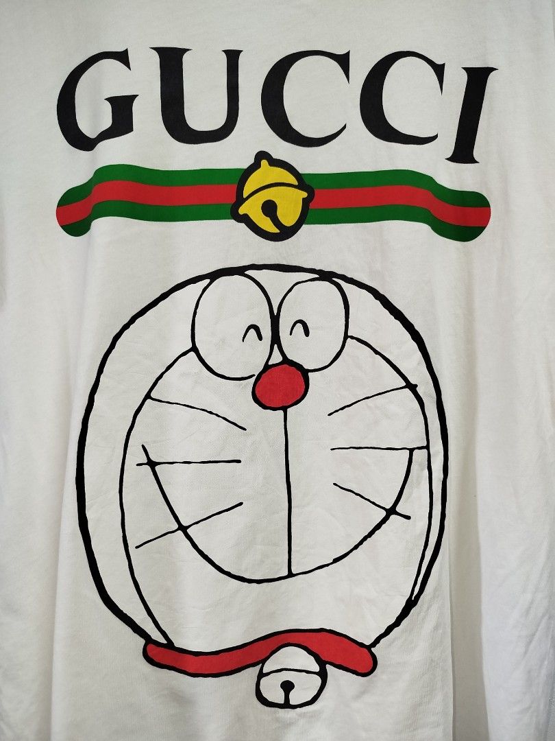 GUCCI DORAEMON WHITE SHIRT (Category: Tshirts & Polo Shirts ) located in Bayombong. Submitted by Gentlemans_ClosEt (Listing ID 1463644568, Image 2). Description: GUCCI X DORAEMON WHITE SHIRT (authentic) searchable code SIZE LARGE ON TAG DIMES: W21 x L26 EXCELLENT CONDITION MISSING MAINTAG/NECKTAG ONLY.