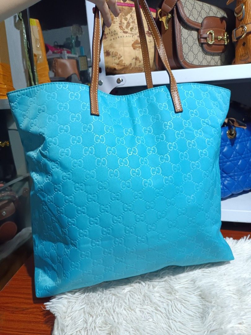Gucci GG Monogram Nylon Tote Bag (Category: Luxury Bags & Wallets) located in Naga. Submitted by zksboutique (Listing ID 1463688666, Image 3). Description: -Turquoise Blue Gucci Tote Bag - All-over GG Monogram Pattern - Genuine Leather Trim and Handles - Spacious Interior for Essentials - Expertly Crafted in Italy - Ideal for Everyday Use or Travel.