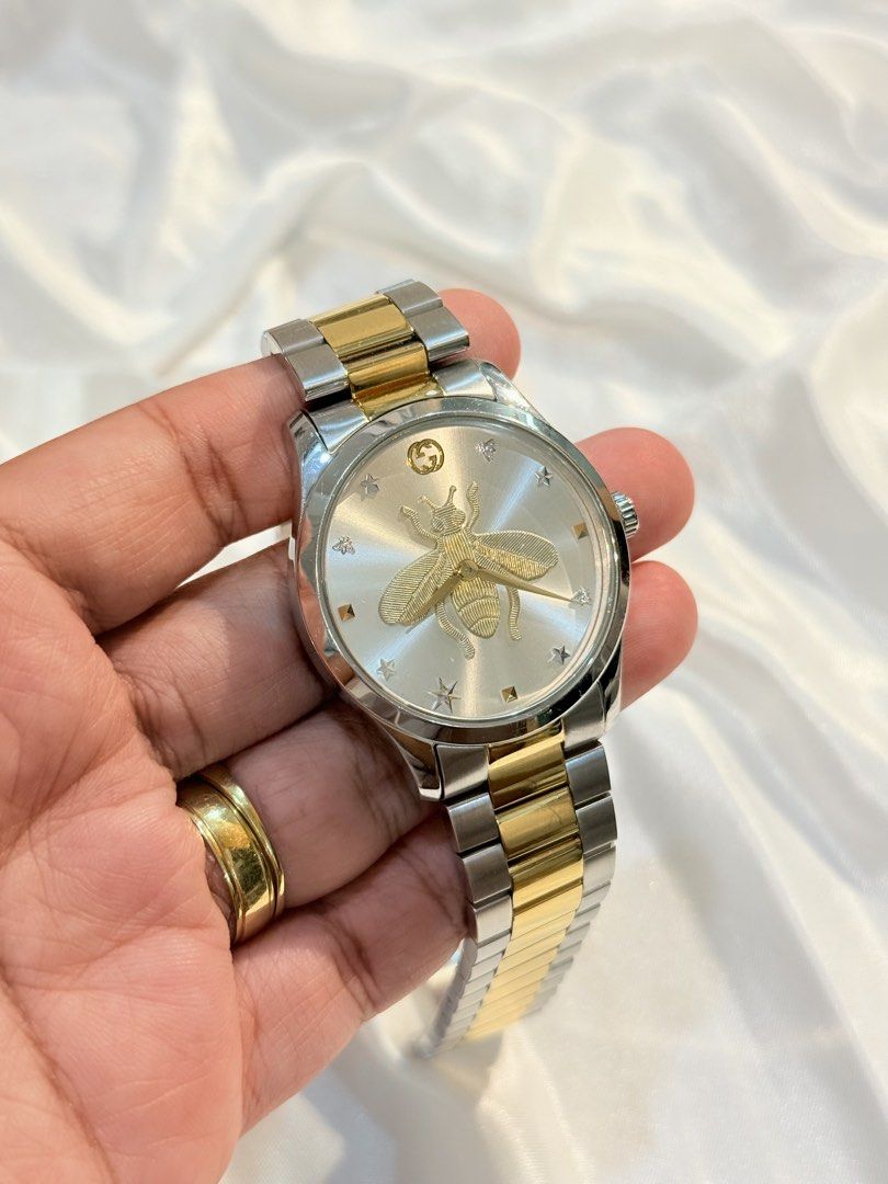 Gucci G-Timeless Bee Watch (Category: Luxury Watches) located in Taguig. Submitted by eunicesuperb (Listing ID 1463635448, Image 3). Description: - Authentic Gucci G-Timeless Watch - Iconic Bee Motif on Dial - Two-Tone Stainless Steel Bracelet - Comes with Original Box and Packaging - Versatile for Everyday or Special Occasions.