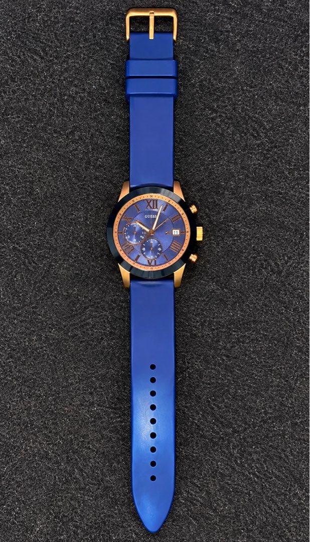 Guess Blue & Rose Gold Chronograph Watch (Category: Men's Watches) located in Rizal. Submitted by monstermac57639 (Listing ID 1463582150, Image 1). Description: - Stunning blue dial with elegant rose gold accents. - Functional date window and chronograph sub-dials. - Comfortable and vibrant bright blue silicone strap. - Secure rose gold buckle. - Versatile design, ideal for both casual and formal wear..