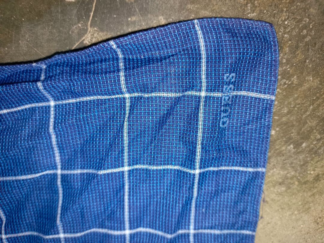 Guess Blue Plaid Fabric (Category: Luxury Accessories) located in Caloocan City. Submitted by jie_theseller17 (Listing ID 1463673251, Image 2). Description: - Blue fabric with white plaid pattern - Guess logo subtly woven in - Waffle knit texture - Ideal for sewing and crafting projects.