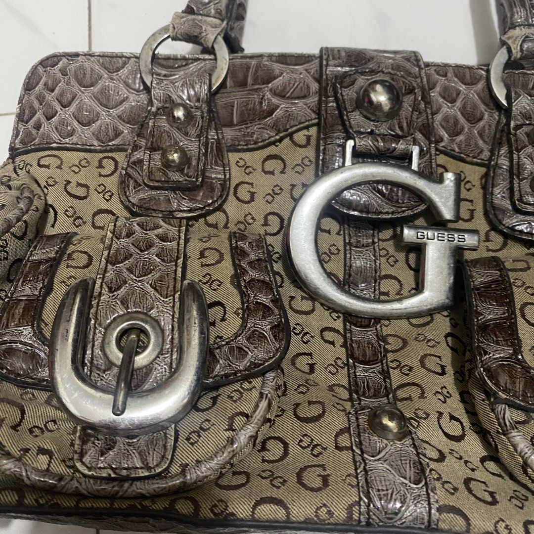 Guess Vintage Monogram Shoulder Bag (Category: Shoulder Bags) located in Manila. Submitted by dejesusjustin0704 (Listing ID 1463598926, Image 2). Description: - Authentic brown Guess shoulder bag - Signature G monogram print all over - Elegant croc-embossed accents - Large silver G logo on the front - Decorative buckle details on front pockets - Comfortable top handle for carrying - Secure zipper closure for main compartment.