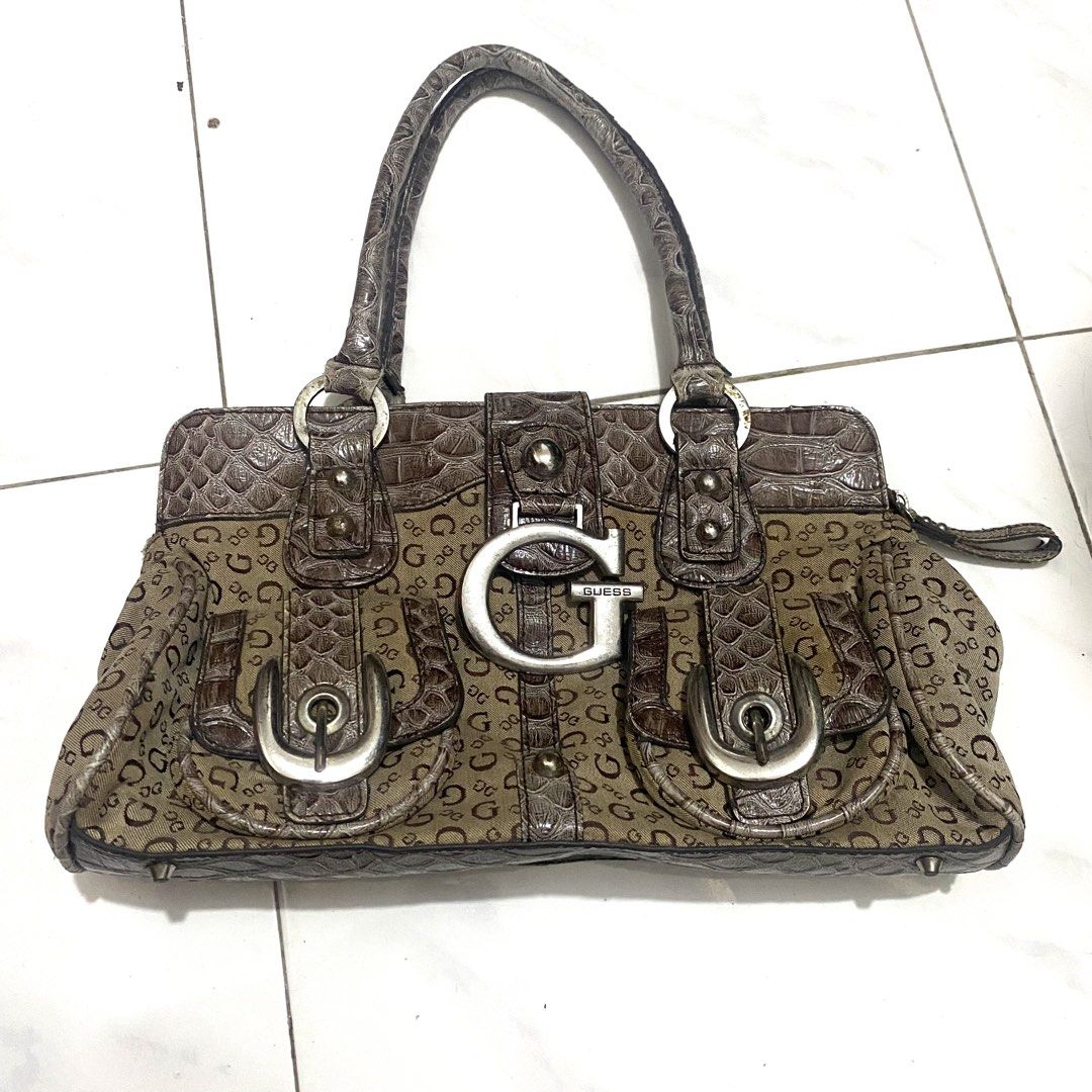Guess Vintage Monogram Shoulder Bag (Category: Shoulder Bags) located in Manila. Submitted by dejesusjustin0704 (Listing ID 1463598926, Image 1). Description: - Authentic brown Guess shoulder bag - Signature G monogram print all over - Elegant croc-embossed accents - Large silver G logo on the front - Decorative buckle details on front pockets - Comfortable top handle for carrying - Secure zipper closure for main compartment.