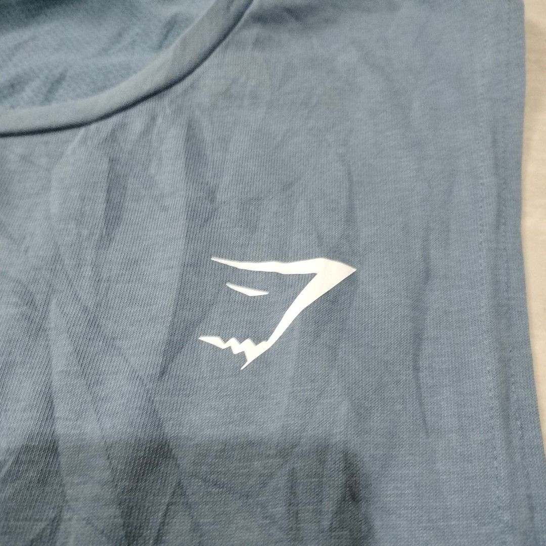GYMSHARK MUSCLE TANK (Category: Activewear) located in Sariaya. Submitted by social_animalz (Listing ID 1463637448, Image 2). Description: 21 x 29 may maliit na run sa loob shipping fee is not included.