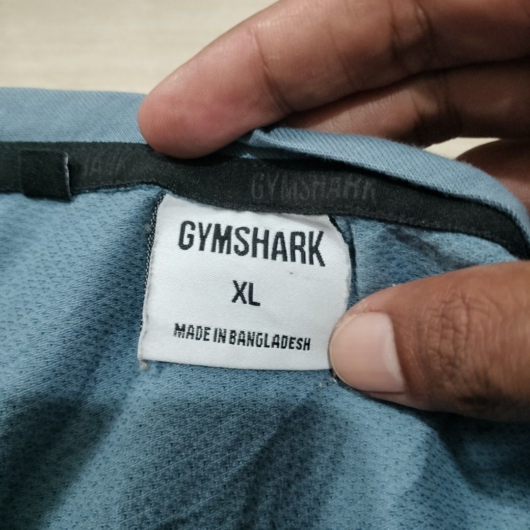 GYMSHARK MUSCLE TANK (Category: Activewear) located in Sariaya. Submitted by social_animalz (Listing ID 1463637448, Image 3). Description: 21 x 29 may maliit na run sa loob shipping fee is not included.