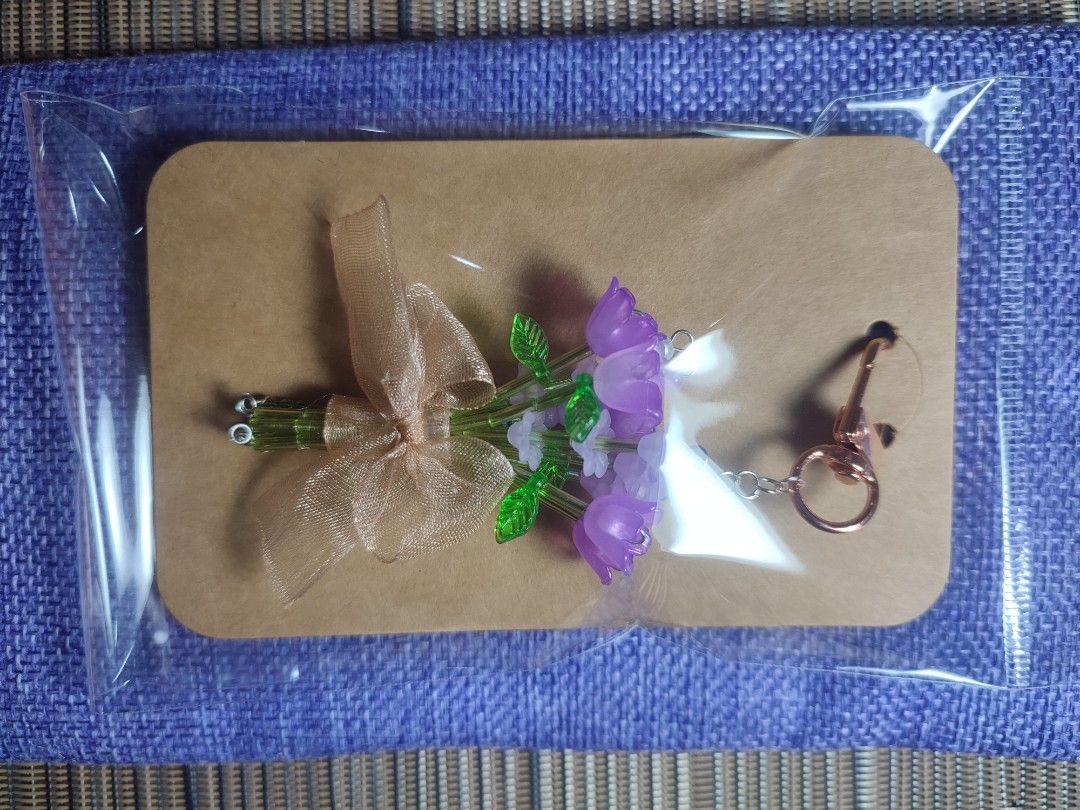 Handmade Beaded Flower Bouquet Keychain (Category: Handmade Craft) located in Manila. Submitted by messiscar290860 (Listing ID 1463556381, Image 3). Description: - Adorable handmade keychain with a beaded flower bouquet. - Finished with a delicate sheer ribbon and a stylish rose gold clasp. - A unique and charming accessory for your bag, backpack, or as a thoughtful gift..