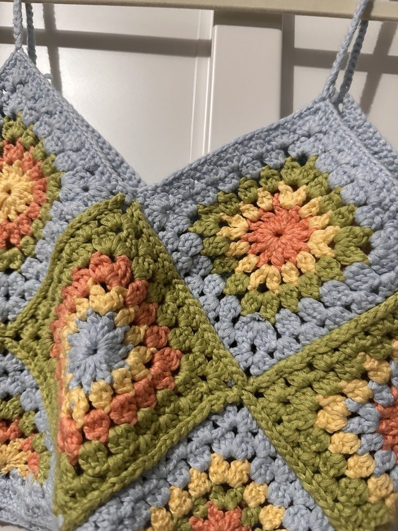 Handmade Crochet Granny Square Crop Top (Category: Sleeveless) located in Caloocan City. Submitted by tiannnaaa (Listing ID 1463683867, Image 2). Description: - fixed price posted, won’t reply to hagglers Super cute handmade crochet crop top - Features a colorful granny square design (blue, green, yellow, coral) - Spaghetti straps - Ideal for festivals or casual outings - Unique, one-of-a-kind piece.