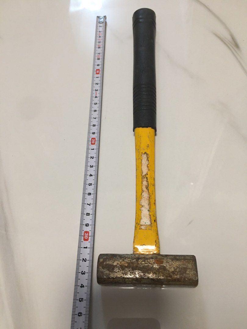 Heavy Duty Sledgehammer with Rubber Grip Handle (Category: Construction Tools & Equipment) located in Pasay City. Submitted by gilbertso62551 (Listing ID 1463665683, Image 2). Description: - Solid metal hammer with a durable yellow painted handle. - Features a black rubber grip for enhanced handling and control. - Still highly functional and reliable for heavy-duty tasks. - Measurements are clearly shown in the product photos. - Ideal tool for co