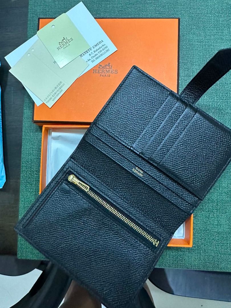 Hermes Black Leather Wallet with Zipper (Category: Wallets & Card holders) located in Caloocan City. Submitted by johncarlob91082 (Listing ID 1463662902, Image 2). Description: - Authentic Hermes wallet - Color: Black leather - Features: Multiple card slots, zippered compartment - Includes: Original box, authenticity cards - Purchase origin: Hankyu Umeda - Perfect for organizing essentials Hermes Bearn Compact Wallet with LegitGrails Certificate 