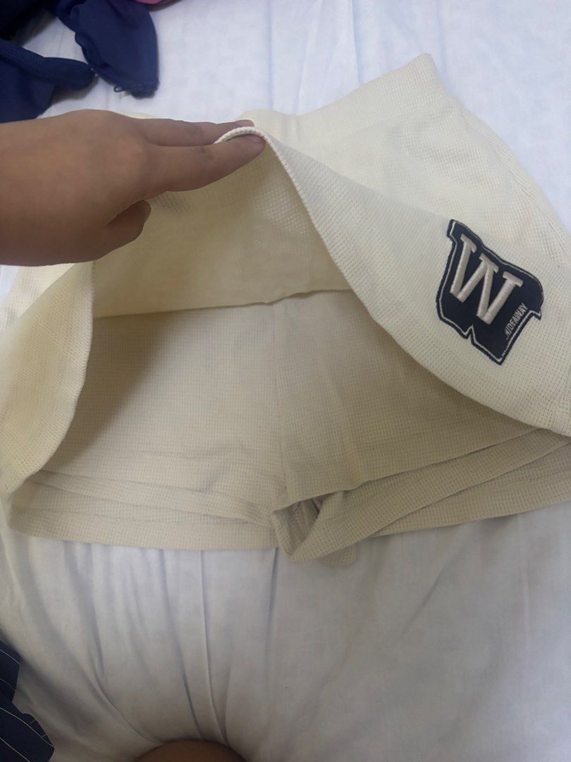 Hideaway W Logo Shorts (Category: Shorts) located in Rizal. Submitted by gwen.gala (Listing ID 1463613259, Image 2). Description: - Cream colored shorts - Waffle knit material - Elastic waistband for comfort - Features a stylish 'W' logo patch - Estimated size: Medium - Ideal for casual outings and everyday wear.