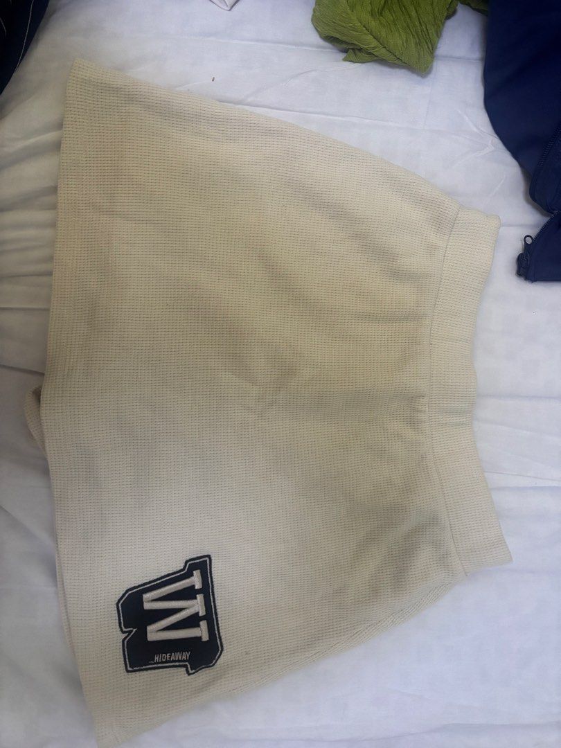 Hideaway W Logo Shorts (Category: Shorts) located in Rizal. Submitted by gwen.gala (Listing ID 1463613259, Image 1). Description: - Cream colored shorts - Waffle knit material - Elastic waistband for comfort - Features a stylish 'W' logo patch - Estimated size: Medium - Ideal for casual outings and everyday wear.