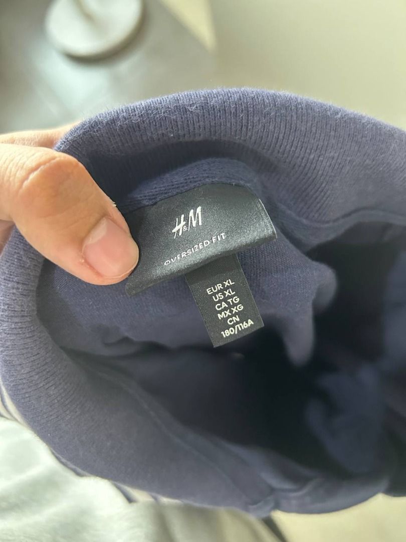 H&M Oversized Fit Navy Blue Polo | Graphic (Category: Tshirts & Polo Shirts ) located in Taguig. Submitted by MoveQuickly (Listing ID 1463626906, Image 2). Description: - Brand: H&M - Color: Navy Blue - Fit: Oversized - Size: XL - Features: White text graphic on front, striped collar detail - Sleeves: Short sleeves - Style: Great for a casual look.
